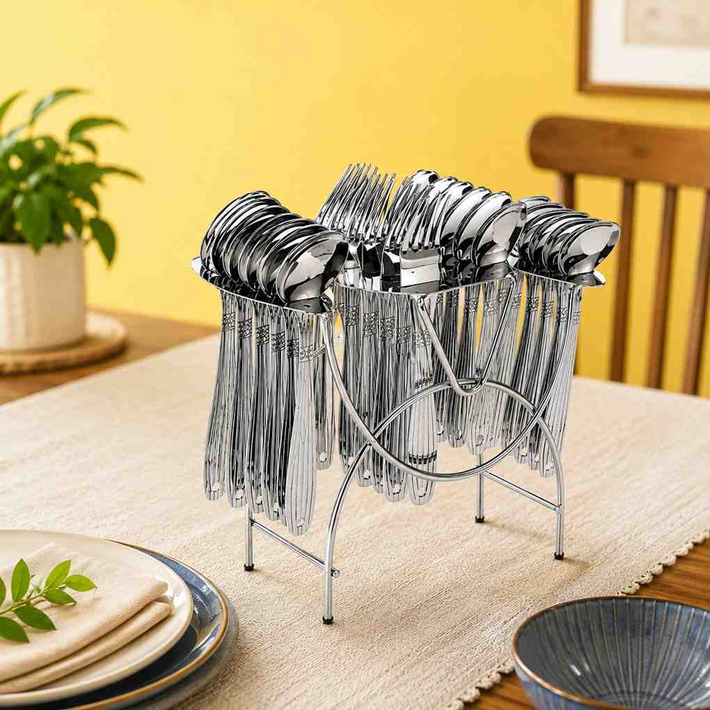 Shruti Stainless Steel 24 Pcs Cutlery Set with Stand placed on a dining table